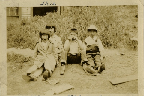 Four children in Nihonmachi, or Japantown (ddr-densho-117-1)