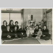 Family poses by memorial table (ddr-densho-359-1156)