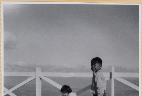 Susan and William Shiomi by fence (ddr-densho-522-302)