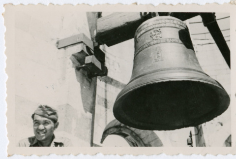 Soldier in front of large bell (ddr-densho-368-46)