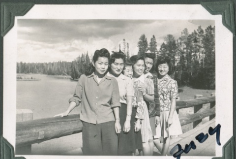 Group of women stand on bridge (ddr-densho-321-69)