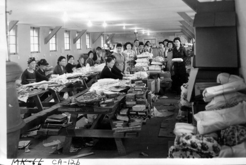 Japanese Americans sorting Christmas presents (ddr-densho-37-678)