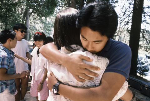 Charles Yuki giving a hug during communion on the last day of camp (ddr-densho-336-1808)