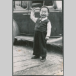 Boy standing by car (ddr-densho-523-77)