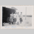 Four woman standing outside building with sign, Station 21-27 (ddr-densho-464-22)
