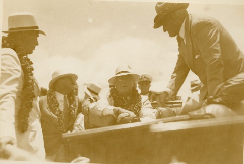 Franklin D. Roosevelt wearing leis in a car (ddr-njpa-1-1608)