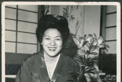 Woman in kimono with flowers (ddr-densho-316-358)