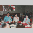 Three people sitting at a table (ddr-densho-426-2222)