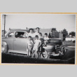 Family standing next to car (ddr-densho-522-69)