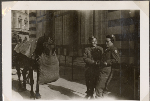 Two men standing by horse (ddr-densho-466-59)