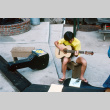 Kyle Kashima playing guitar (ddr-densho-336-994)