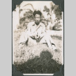Man sitting in grass (ddr-ajah-2-570)
