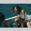 Kathy Kashima in a row boat during boat sink (ddr-densho-336-1118)