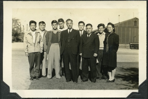 Rev. Shinjo Nagatomi posing with a group (ddr-manz-4-231)