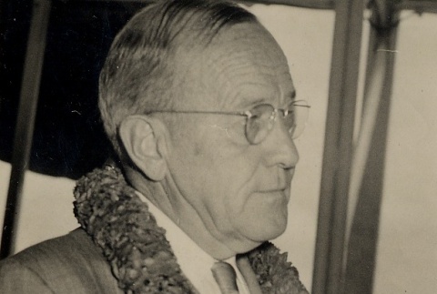 Man wearing lei shaking hands with another man [not pictured] (ddr-njpa-2-369)