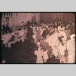People seated and standing at and around two tables (ddr-densho-330-206)