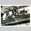Soldier and two women on a balcony (ddr-densho-22-244)