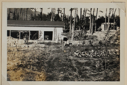 Man carrying watering cans (ddr-densho-433-671)