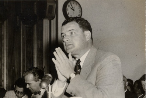Man speaking at a conference or court hearing (ddr-njpa-2-227)