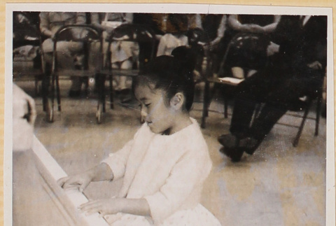 Susan playing piano (ddr-densho-522-596)