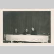 Two priests and man seated at table (ddr-densho-330-276)