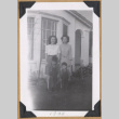 Women and boys pose on a lawn (ddr-densho-542-315)