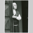 Woman looking out of doorway (ddr-densho-1007-275)
