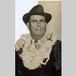 Judge James L. Coke posing with leis (ddr-njpa-2-159)