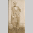 Man leaning on building (ddr-densho-523-10)