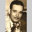 Man wearing leis (ddr-njpa-4-2397)