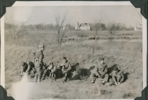 Group of men sitting by grassy hill (ddr-ajah-2-445)