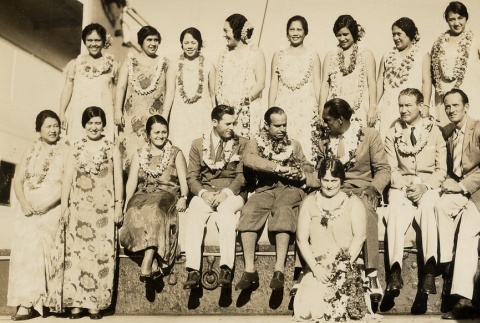Douglas Fairbanks and a group posing in leis (ddr-njpa-1-390)