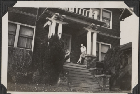 Woman on porch of house (ddr-densho-466-955)