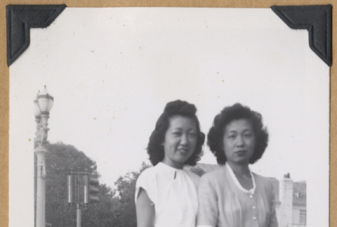 Two women standing with handbags (ddr-densho-542-331)