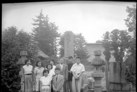 Group standing by stones in cemetery (ddr-densho-426-2470)