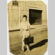 A boy with a briefcase (ddr-densho-22-341)