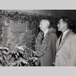 Harold Kainalu Long Castle and Neal Blaisdell reading plaque at the Pali Golf Course clubhouse (ddr-njpa-2-128)