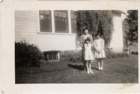 Morita sisters outside Dethman's house the day they left Pinedale Assembly Center (ddr-densho-409-69)
