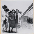 Four women standing on fence (ddr-densho-522-51)