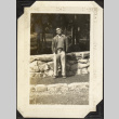 Man standing by stone wall (ddr-densho-326-486)