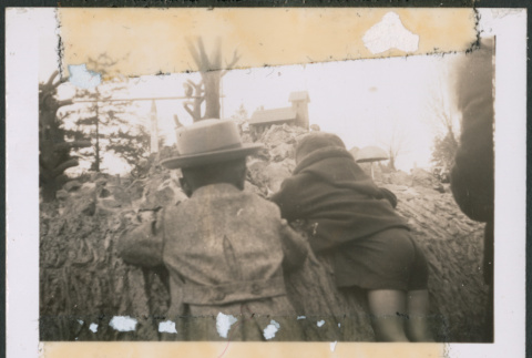 Two boys climbing on log (ddr-densho-483-1091)