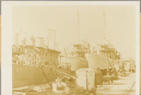 Navy ships moored to a dock (ddr-njpa-13-344)