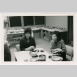 Tomoye Takahashi and woman (possibly Martha Suzuki) seated at table (ddr-densho-426-1110)