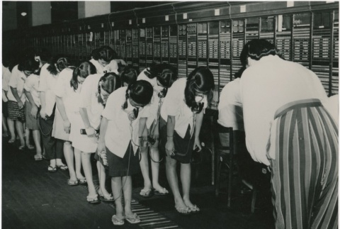 Telephone operators before starting work (ddr-densho-299-193)