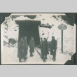Six men standing outside train tunnel in snow (ddr-ajah-2-314)