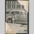Two girls in front of a car (ddr-densho-321-35)