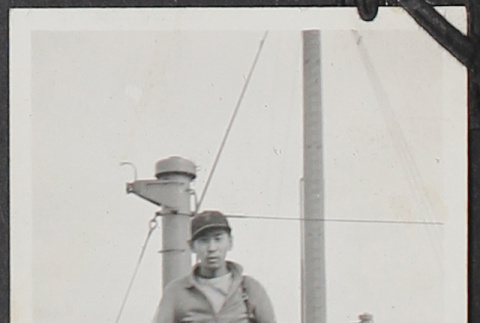 Young man with Hikawa Maru Tokyo life ring (ddr-densho-326-87)