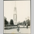 A woman standing in front of a tower on Treasure Island (ddr-densho-298-293)