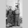 Two priests in front of building (ddr-densho-330-258)