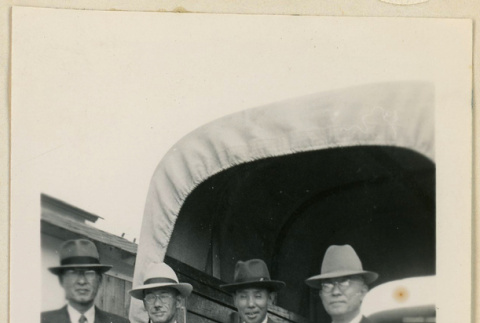 Co-op delegates pose in front of a truck (ddr-densho-37-866)